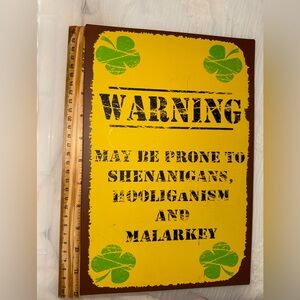 Yellow Warning Tin Sign with Green Clovers